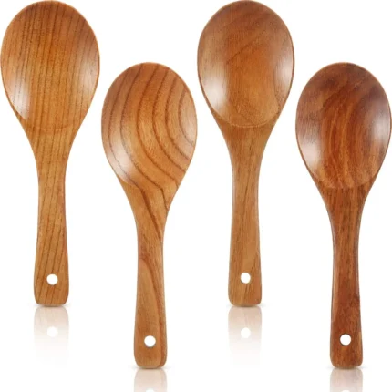 Four brown wooden cooking spoons