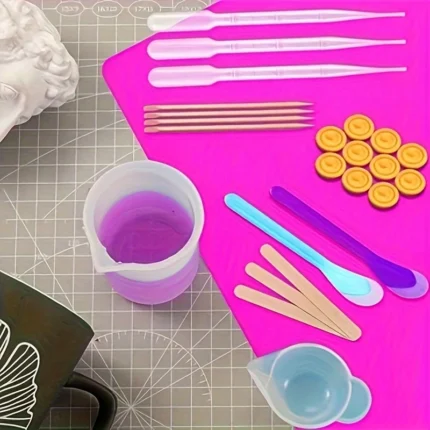 Pink 49-piece silicone mold and epoxy resin crafting tool set with measuring cups and droppers
