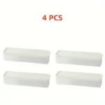Four clear rectangular reusable plastic food storage containers arranged for refrigerator organization