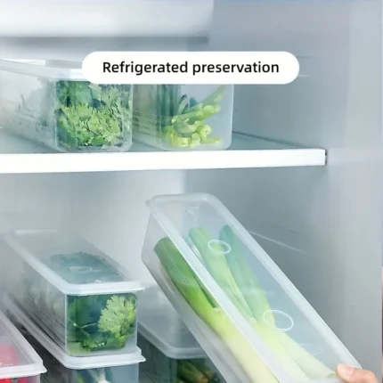 Four clear rectangular reusable plastic food storage containers arranged for refrigerator organization