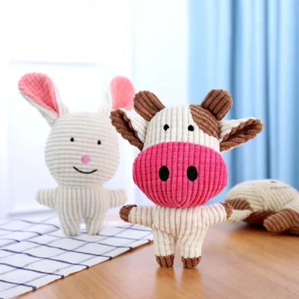 Plush squeaky dog toy available in pig, elephant, rabbit, and cow designs